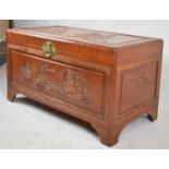 An Oriental Camphor Wood Chest with Carved Hinged Lid Depicting Pagoda and Ship, 101cm wide