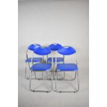 A Set of Four Folding Chairs