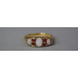 An 18ct Gold Opal and Ruby Boat Ring, Chester Hallmark, Shank AF, Size P