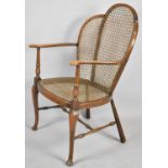 An Edwardian Cane Seated and Backed Ladies Armchair