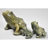 A Set of Three Green Glazed Graduated Stoneware Frogs, One with Glued Foot