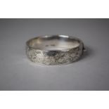 A Silver Bangle Hallmarked Birmingham 1959, Engraved Decoration and unusual safety bar