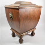 A 19th Century Faux Rosewood Wine Cooler of Sarcophagus Form on Claw and Ball Feet, Hinged Lid and