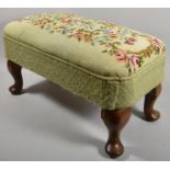 A Rectangular Tapestry Topped Footstool on Short Cabriole Legs, 60cm wide