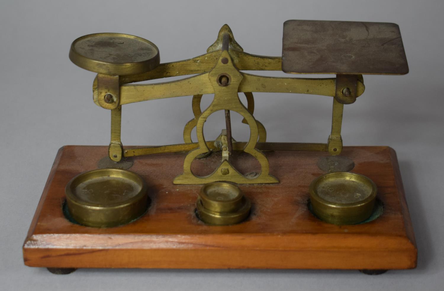 A Set of Desk Top Brass Postage Scales on Wooden Plinth, 17.5cm wide