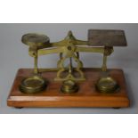 A Set of Desk Top Brass Postage Scales on Wooden Plinth, 17.5cm wide