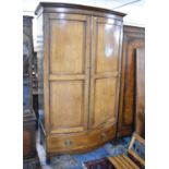 A Bow Fronted Mahogany Wardrobe with Base Drawer and Dentil Cornice, 116cm wide