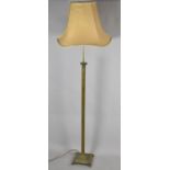 A Mid 20th Century Brass Standard Lamp and Shade on Stepped Square Base with Four Scrolled Feet,