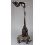 A Carved Chinese Wooden Table Lamp in the Form of a Dragons Head on Circular Base with Four Scrolled