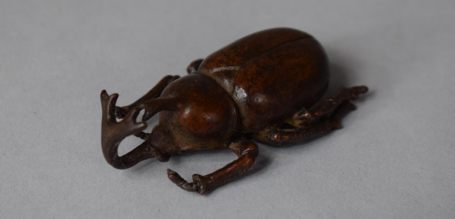 A Bronze Study of a Japanese Horned Rhinoceros Beetle, 6cm wide