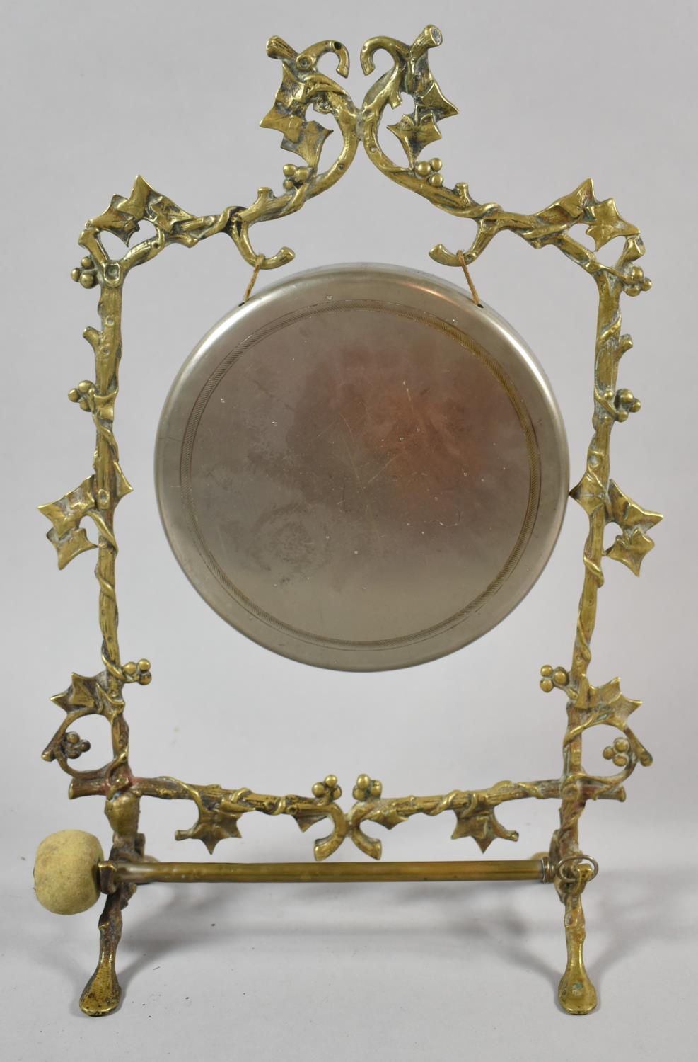 A Brass Table Gong with Clapper, the Frame in the Form of Vine, 36cm High