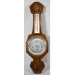 An Art Deco Oak Wall Hanging Aneroid Barometer with Thermometer, 55cm high