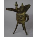 A Chinese Archaistic Style Bronze Tripod Libation Cup, 16cm high
