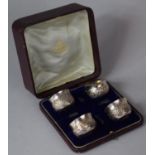 A Cased Set of Four Silver Salts Embossed with Foliate Decoration, London 1897, 59g