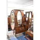 An Edwardian Triple Mirror Mahogany Dressing Table with Inlaid Oval Panels, Quadrant Drawers, Four