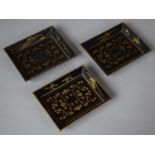 A Set of Three Japanese Meiji Lacquered Rectangular Dishes Decorated with Gilt Floral Design, Each