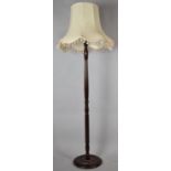 A Modern Turned Mahogany Standard Lamp and Shade