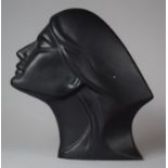 A Black Glazed Ceramic Bust of a Maiden, 21.5cm high