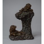 A Chinese Clay Study of Monkeys Set on Naturalist Trunk, 10cm high