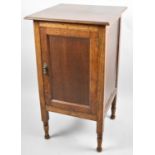 An Edwardian Oak Radio Cabinet with Hinged Lid to Fitted Interior, Panelled Door, 43cm wide
