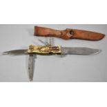 A Vintage German Hunting Multitool Hunting Knife in Leather Sheath, Carved Bone Mounts Decorated