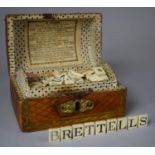 A 19th Century Dome Topped Box in the Form of a Travelling Trunk Containing Bone Alphabetical and