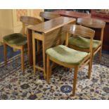 A 1970's Formica Topped Drop Leaf Dining Table and Four Matching Chairs