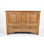 A Mid 20th Century Panelled Oak Lift Top Linenfold Coffer with Armorial Panel and Two Base Drawers
