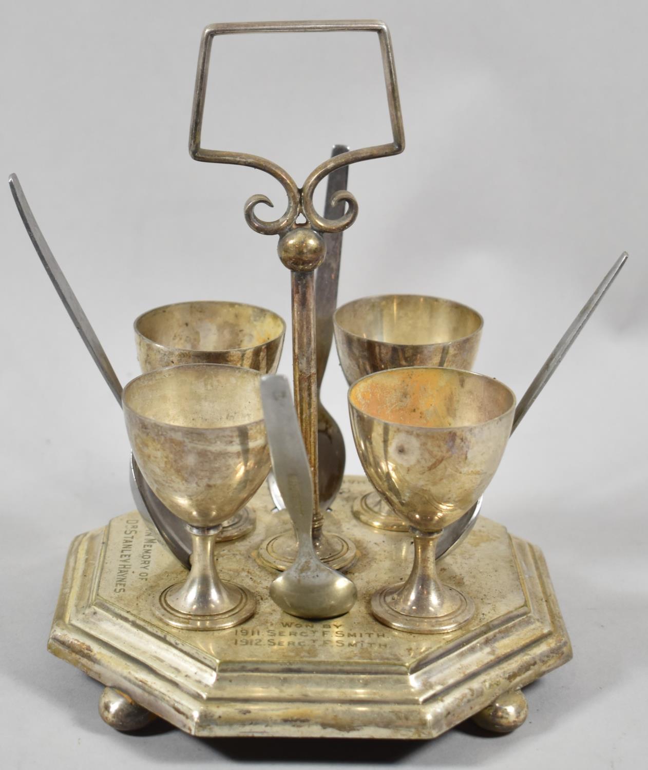 An Edwardian Silver Plated Presentation Four Cup Egg Cruet, Gun Drill Challenge Prize in Memory of