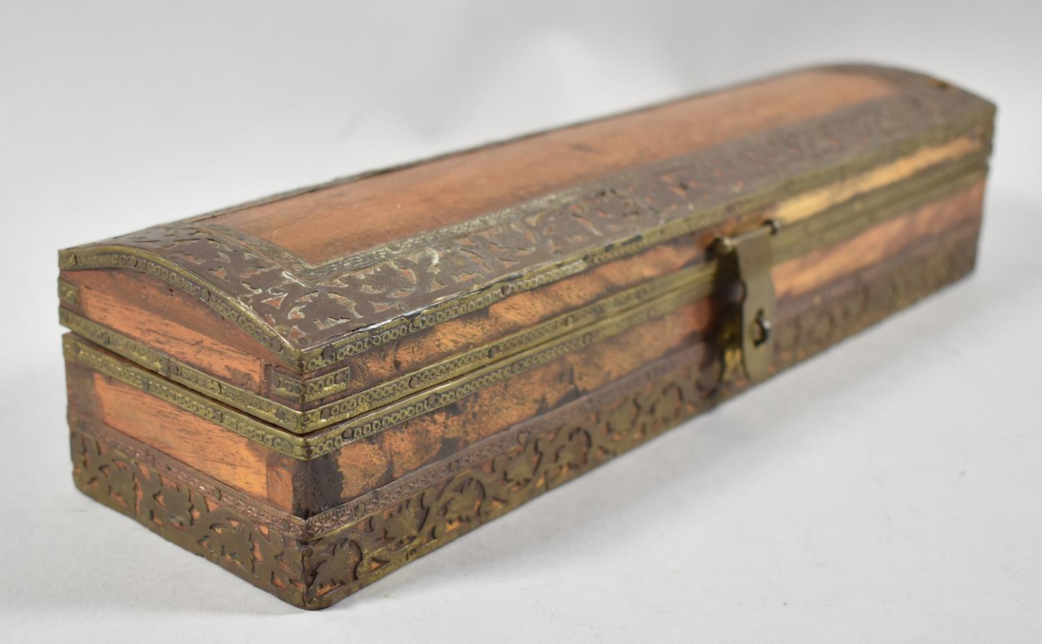 A Far Eastern Brass Mounted Scribe's Pen Box with Three Section Interior, 29cm wide