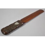 A Continental Wooden Page Turner with Carved Handle Decorated with Vines and Grapes in Relief and