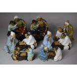 A Collection of Seven Various Oriental Mud Men Figural Groups