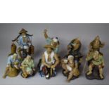 A Collection of Nine Various Large Mud Men Figures