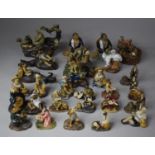 A Large Collection of Small Glazed Mud Men Figures