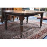 An Edwardian Mahogany Wind-out Dining Table with One Extra Leaf