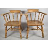 A Pair of Mid 20th Century Smokers Bow Arm Chairs with Spindle Backs