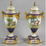 A Pair of Continental Porcelain Table Lamps in the Form of Vases Decorated with Figures on Horseback