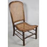 A Late 19th/Early 20th Century Bobbin Framed Cane Upholstered Ladies Nursing Chair