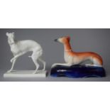 A Late 19th/Early 20th Century Staffordshire Penholder in the Form of a Reclining Greyhound Together