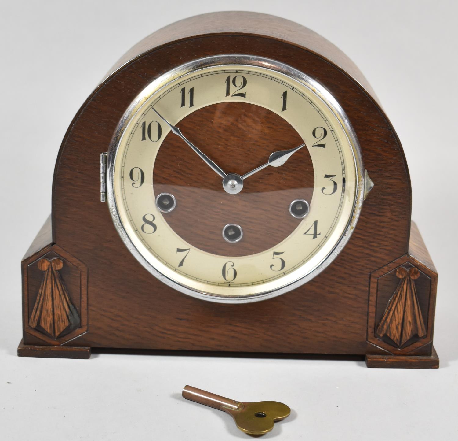 A Mid 20th Century Oak Westminster Chime Mantle Clock with Key and Pendulum