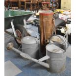 Three Galvanized Iron Watering Cans and a Cylindrical Knapsack Sprayer (incomplete)