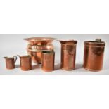 A Copper Planter and Set of Five Copper Measuring Jugs