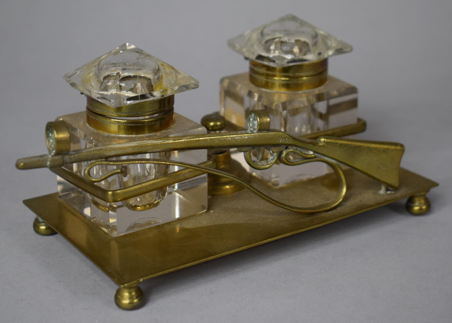 A Brass Desktop Two Bottle Inkstand, the Quill Holder in the Form of a Rifle, on Four Ball Feet, - Image 2 of 2