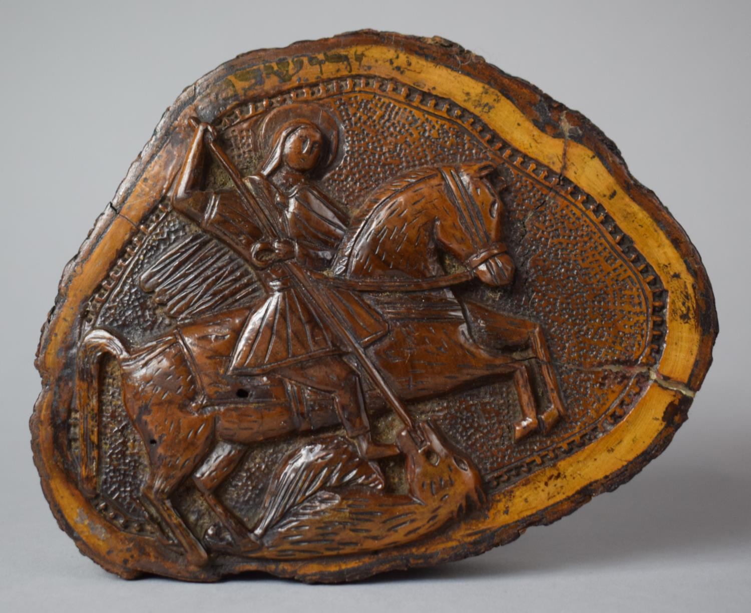 A Carved Wooden Icon Formed From a Section of Tree Trunk and Decorated with St. George and the