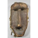 A Carved Wooden Tribal Facemask, Ngindo Tribe, Tanzania, 33cm High