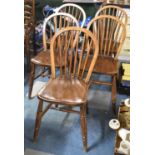 A Set of Five Spindle Back Dining Chairs