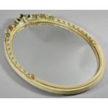 A Moulded Oval Framed Wall Mirror with Floral and Spiralled Decoration, 53cm high