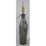 An Early 20th Century Bottle Shaped Pewter Table Lamp Base Decorated in Relief with Leaves and Nuts,