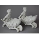A Pair of Continental Creamware Novelty Baskets in the Form of Cherubs Pushing Vine Leaf and Grape