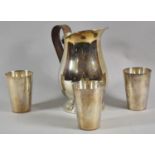 A Leather Handled Silver Plated Jug and Three Silver Plated Beakers, Jug 23cm high